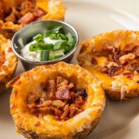 Hof’S Classic Skins · Crisp potato skins with melted cheese, layered with crumbled bacon. Served with sour cream a...