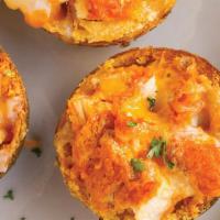 Buffalo Chicken Potato Skins · Crisp potato skins stuffed with buffalo fried chicken and topped with melted jack and chedda...