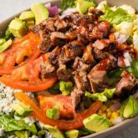 Southern Bbq Tri-Tip Salad · Grilled to order tri-tip steak, mixed greens, corn, bacon, onions, tomatoes, blue cheese, ha...