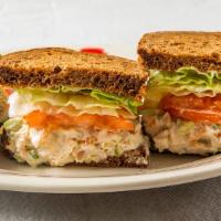 Rotisserie Chicken Salad Sandwich · Chicken salad, lettuce, tomatoes, and mayo on squaw bread.