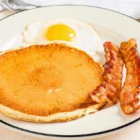  Pancake Breakfast · One pancake, one egg, choice of two strips of bacon or two links of sausage.
