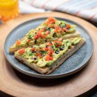 Avocado Toast · mashed avocado mixed with organic chives, organic heirloom tomato, balsamic dressing on hous...