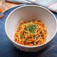 Spaghetti Pomodoro · al dente spaghetti in our homemade fresh tomato, basil + olive oil sauce.