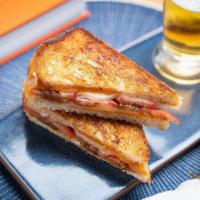 Fancy Grilled Cheese · cheddar, swiss, and havarti cheese, grilled onions, tomato between two slices of buttery gri...