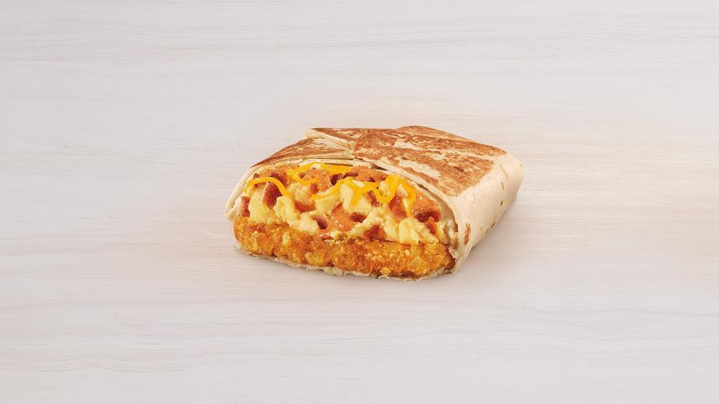 Breakfast Crunchwrap Bacon · A warm flour tortilla layered with a crispy hashbrown, fluffy eggs, bacon, shredded cheddar cheese and creamy jalapeño sauce wrapped in our signature crunchwrap fold and grilled to perfection.
