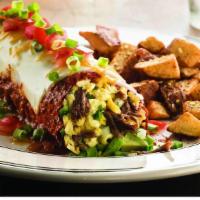 Chipotle Breakfast Burrio · Flour tortilla stuffed with braised beef, melted jack and cheddar cheese, scrambled eggs, av...