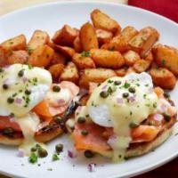 Smoked Salmon Benedict · Cold-smoked Atlantic salmon and poached eggs, topped with hollandaise sauce, diced red onion...