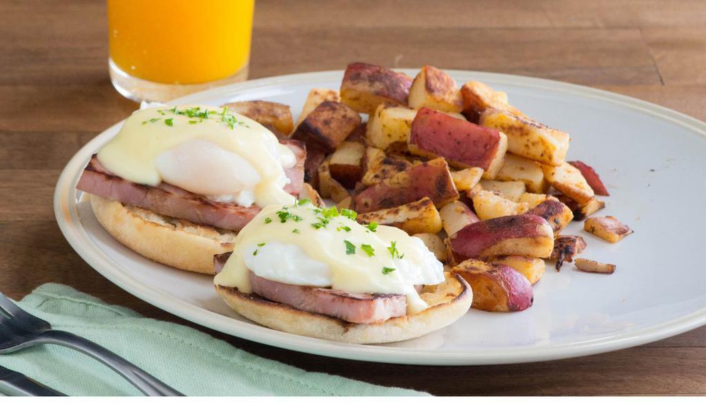 Eggs Benedict · Hickory-smoked ham and poached eggs topped with hollandaise sauce on a grilled English muffin. Served with a side of roasted potatoes. (670 cal) Available every day until 2:00PM