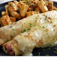 Ham & Cheese Crepes · Thick-cut ham and melted swiss cheese topped with a creamy mornay cheese sauce. Served with ...