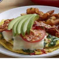Bacon Avocado Omelet · Three eggs, hickory-smoked bacon, spinach, tomatoes, Monterey jack cheese and avocado. Serve...