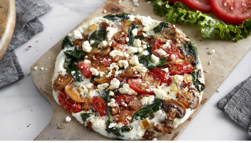 Egg White & Veggie Omelet · Three eggs, spinach, tomatoes, mushrooms, caramelized onions and crumbled feta cheese. Served with sliced tomatoes. (230 cal).
