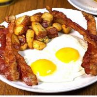 Hickory-Smoked Bac & Eggs · Two eggs* (160 Cal) served any style with ickory smoked bacon (300-910 Cal), roasted potatoe...