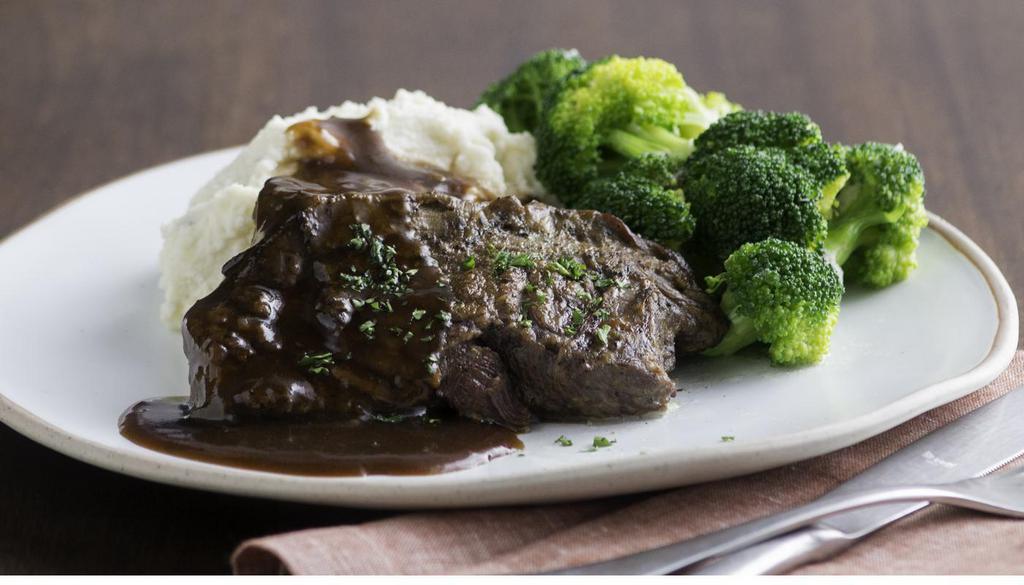 Pot Roast · Slowly braised and simmered in red wine shallot gravy. Served with choice of two sides. (460 Cal)