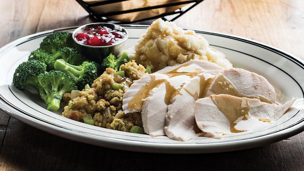 Turkey Dinner · Slow-roasted turkey with gravy, cornbread stuffing and orange-apple cranberry relish. Served with choice of two sides. (700 cal) .
