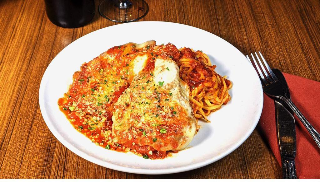 Tuscan Chicken · Crispy hand breaded parmesan chicken breast with melted mozzarella and marinara sauce over linguine. (1290 Cal)