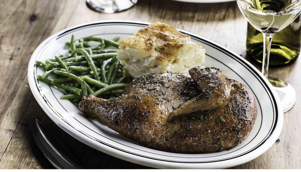 Roasted Half Chicken · Slow-roasted with housemade herb butter. Served with choice of two sides. (600 Cal)