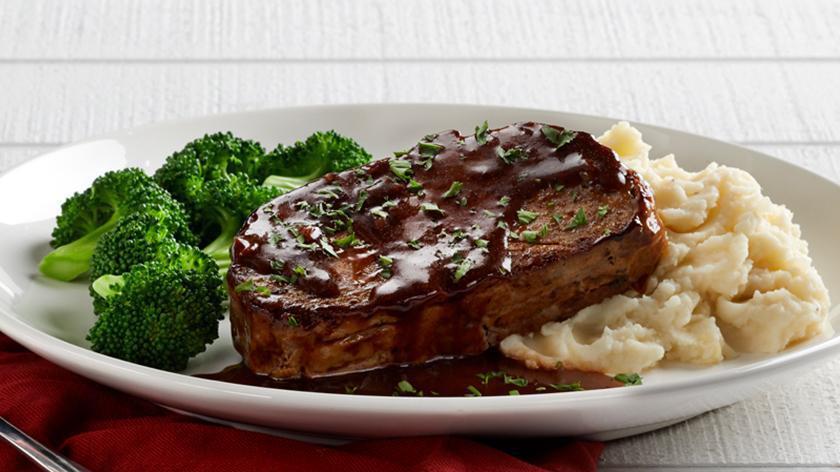 Meatloaf · Our housemade recipe topped with a red wine shallot sauce. Served with choice of two sides. (450 cal).