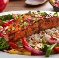 Glazed Salmon · Grilled and topped with a sweet honey glaze. Served with sautéed vegetables and long grain r...