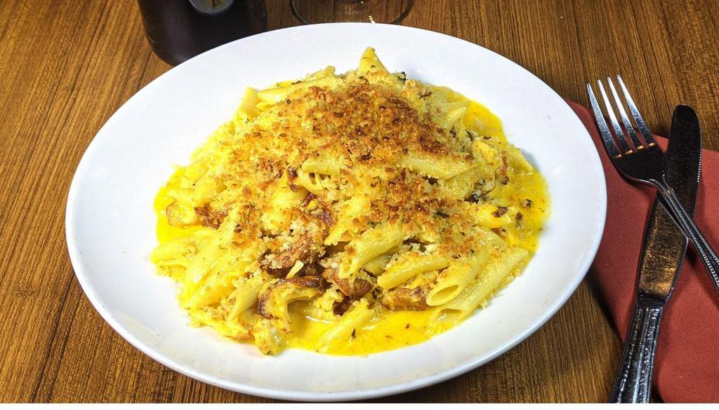 Chicken Cheddar Mac · Roasted chicken, crumbled bacon with penne in a rich cheddar sauce baked with a parmesan crust. (1390 Cal)