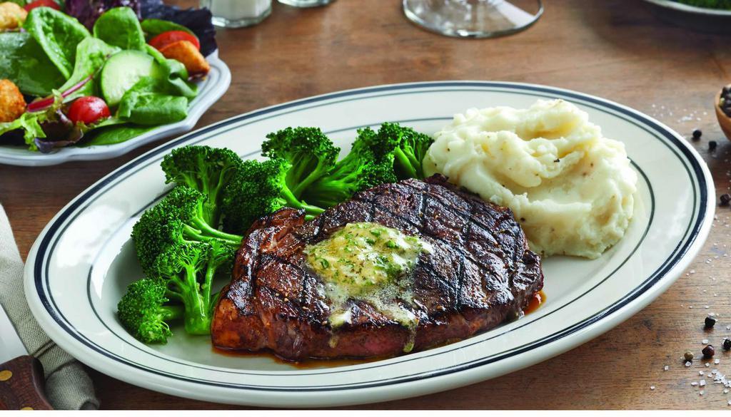 Ribeye Steak · 28-day aged, 10 oz. USDA choice ribeye steak. House-made herbes de Provence butter available upon request, your choice blackened or grilled. Served with choice of two sides. (890 cal) .