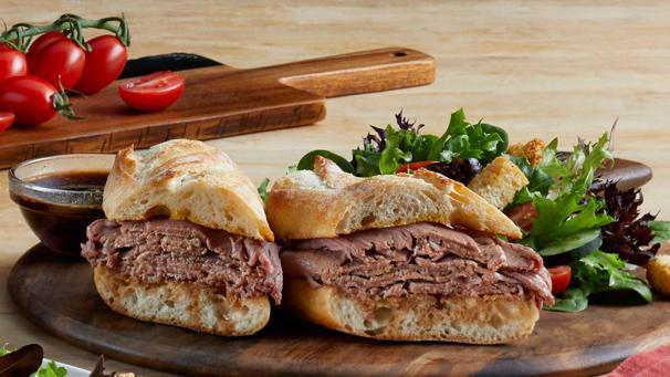 French Dip · Sliced roast beef on a toasted baguette with a side of au jus. (580 cal) .