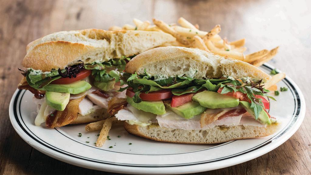 Turkey Pesto Ciabatta · Slow-roasted turkey, bacon, mozzarella, avocado, tomato, baby greens, with balsamic dressing and basil pesto mayo on grilled ciabatta bread. (1030 Cal)