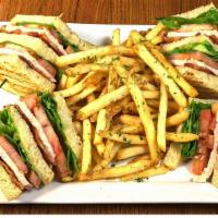 Club · Triple decker of slow-roasted turkey, bacon, lettuce, tomato and mayonnaise on toasted sourd...