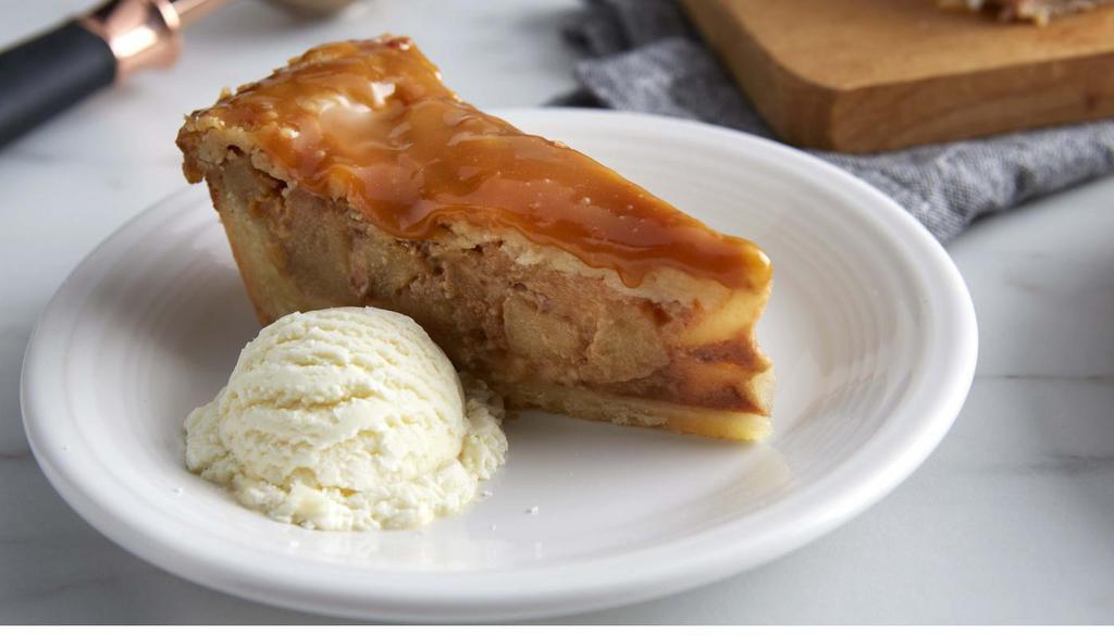 Caramel Apple Pie · Warm, buttery caramel and toffee-studded custard with fresh granny smith apples in our melt-in-your-mouth shortbread crust. Served with a scoop of vanilla ice cream. (500 cal) .