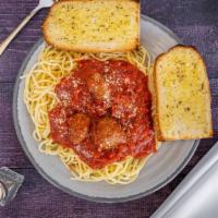 Spaghetti With Meatball Dinner · Includes garlic bread and a salad.