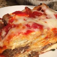 Lasagna With Meat Dinner · Includes garlic bread and a salad.