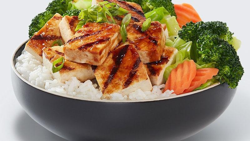 Tofu Veggie Bowl · Grilled tofu hand basted with our signature WaBa sauce and served on a bed of rice with of steamed veggies.