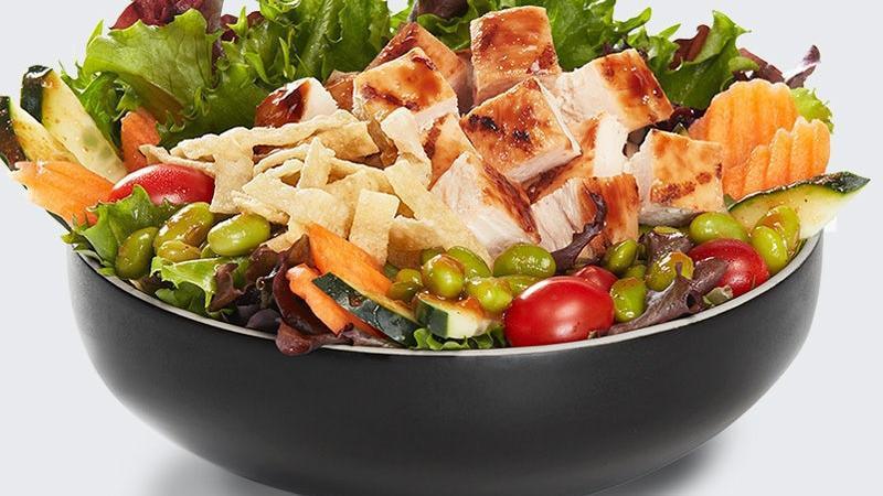 Spicy Asian Salad · Arcadian blend salad topped with cucumber, cherry tomatoes, carrots and grilled white meat chicken. Served with Spicy Asian dressing and wonton strips on the side.