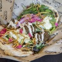 Organic Green Herb Falafel Sandwich · (V) House flat bread, hummus, pickled turnips & radishes, marinated cabbage and onions, seas...