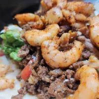 Burrito Ala Costa Azul · Shrimp chicken and steak burrito with rice beans pico de gallo guacamole sour cream and lett...