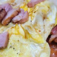 Breakfast Burrito  · Breakfast burrito with cottage cheese potatoes bacon or sausage scrambled eggs