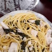 Chicken On Spinach · Lots of delicious sautéed fresh spinach with chicken breast in a basil and fresh garlic wine...