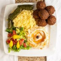 Falafel Plate · A mix of golden garbanzo beans with garlic, onions, herbs, and spices. Served with salad, hu...