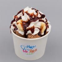 Monkey Business Ice Cream · Chocolate or Vanilla base with Bananas, Graham Crackers, and Nutella inside, topped with Whi...