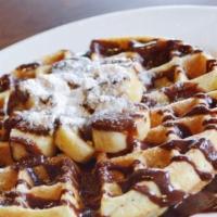 Banana & Nutella · Belgian Waffle topped with fresh banana, a drizzle of nutella & a light layer of powered sugar