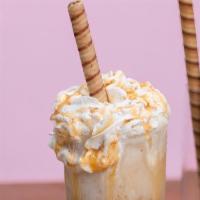 Caramel Frappe · Ghirardelli caramel blended with whole milk, espresso, and topped with whip cream.