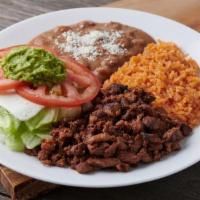 Plato Milanesa · Breaded Steak - Includes a small side salad, rice, beans, and tortillas of your choice.