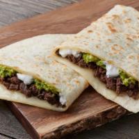 Super Quesadilla Pastor · Marinated Pork - Sour cream, avocado, and melted cheese.