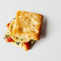 Roasted Tomato, Spinach & Feta Sandwich · Vegetable Egg White Patty, Bistro Bun, Roasted Tomatoes, Neufchatel Cheese, Spinach, Feta Ch...