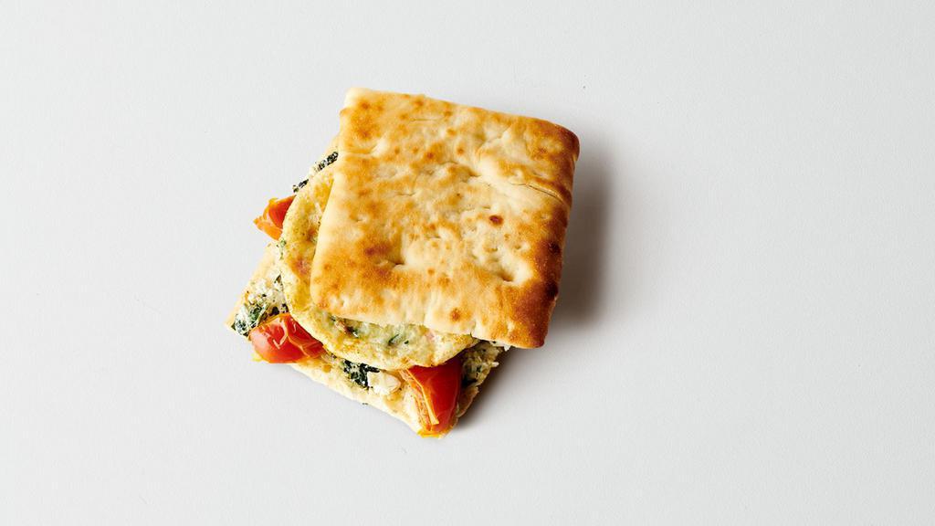 Roasted Tomato, Spinach & Feta Sandwich · Vegetable Egg White Patty, Bistro Bun, Roasted Tomatoes, Neufchatel Cheese, Spinach, Feta Cheese.. cals: 240. (Contains Egg, Milk, Soy, Wheat)