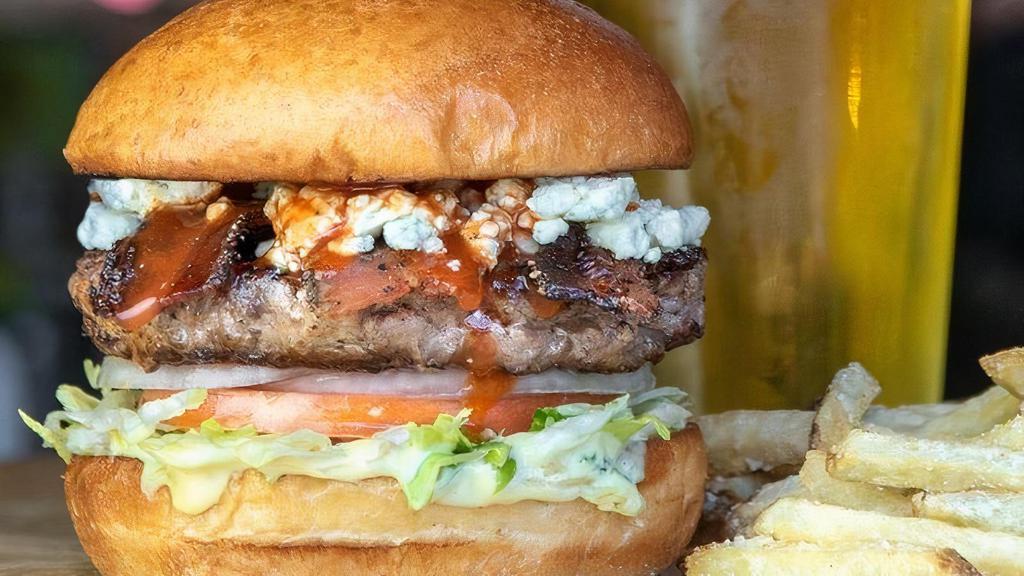 Buffalo Bill · Our Force of Nature Regenerative Grass-Fed Bison burger topped with blue cheese, steakhouse bacon, lettuce, tomato, onion, buffalo sauce & Doddy Mayo.