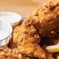 Crispy Chicken Tenders · Hand-breaded crispy chicken tenders - choose Nashville hot or not, served with Alabama comeb...