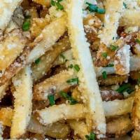 Parmesan Truffle Fries · Hand-cut fries tossed with Truffle Oil, Parmesan & Chives. Served with Truffle Aioli.. This ...