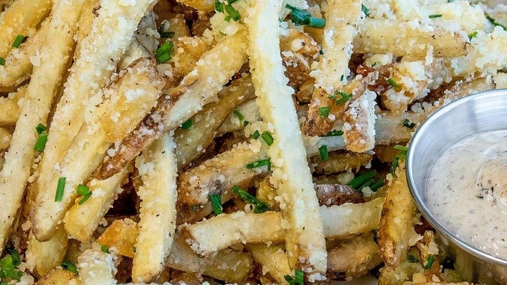 Parmesan Truffle Fries · Hand-cut fries tossed with Truffle Oil, Parmesan & Chives. Served with Truffle Aioli.. This item is gluten friendly.  If you have an allergy, please let the kitchen know.