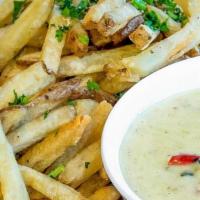 Green Chile Queso Fries · Hand-cut fries served with our famous Queso for dipping. This item is gluten friendly.  If y...