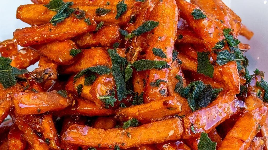 Hot Honey & Sage Fries · Sweet potato fries tossed with hot honey sauce & crispy sage. This item is gluten friendly.  If you have an allergy, please let the kitchen know.